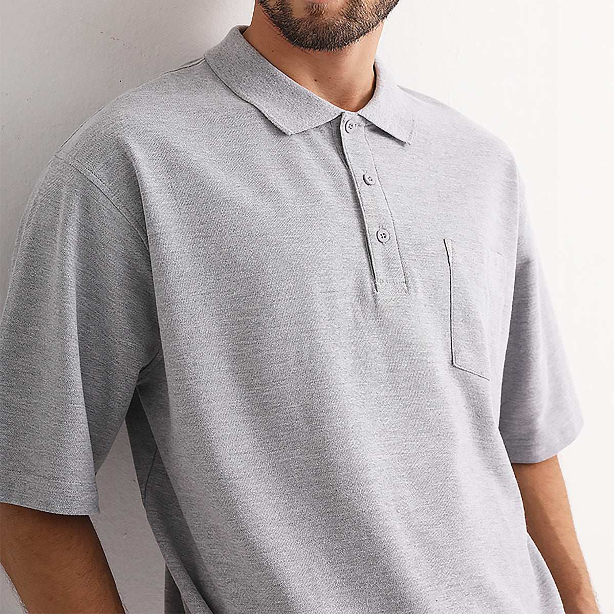 cotton blend polo shirt in grey, model lifestyle scene – ISUSI