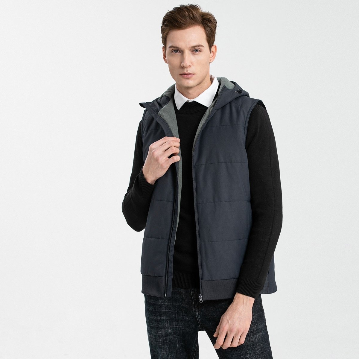 essential puffer vest in black, model posed – ISUSI