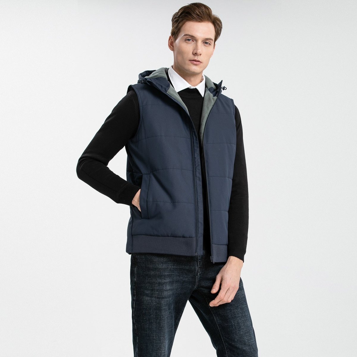 essential puffer vest in blue-navy, model posed – ISUSI