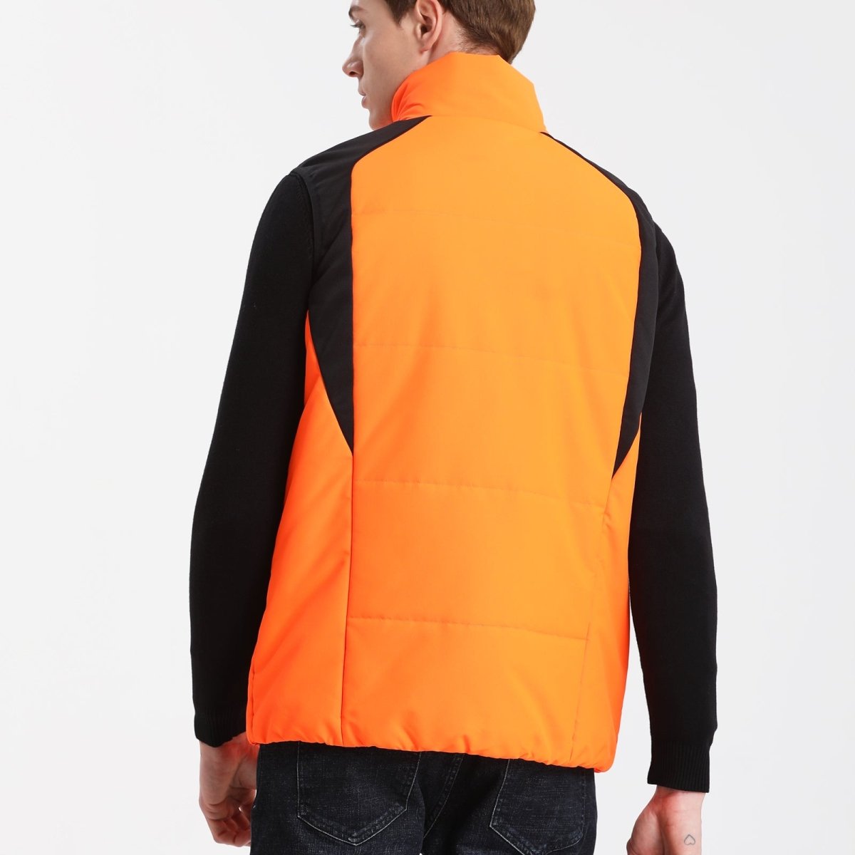 strike puffer vest in orange, model back – ISUSI