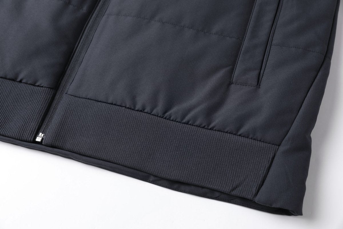 "essential puffer vest hem detail close-up – ISUSI"