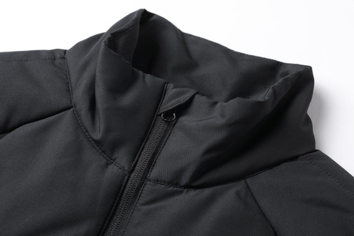 "elite puffer vest collar detail close-up – ISUSI"