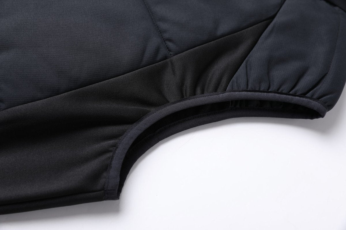 "elite puffer vest side detail close-up – ISUSI"