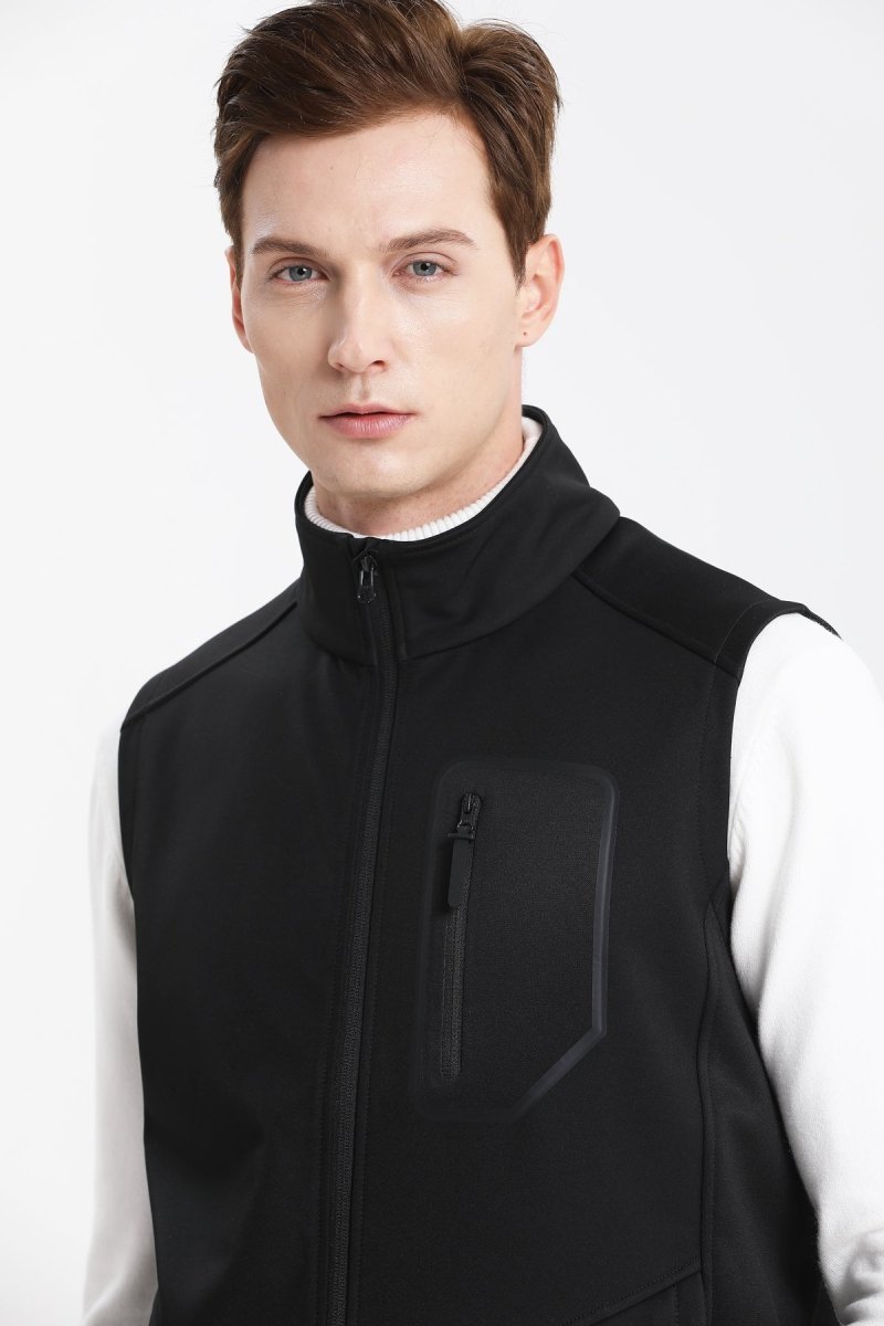 "i.t. softshell vest in black, model posed – ISUSI"