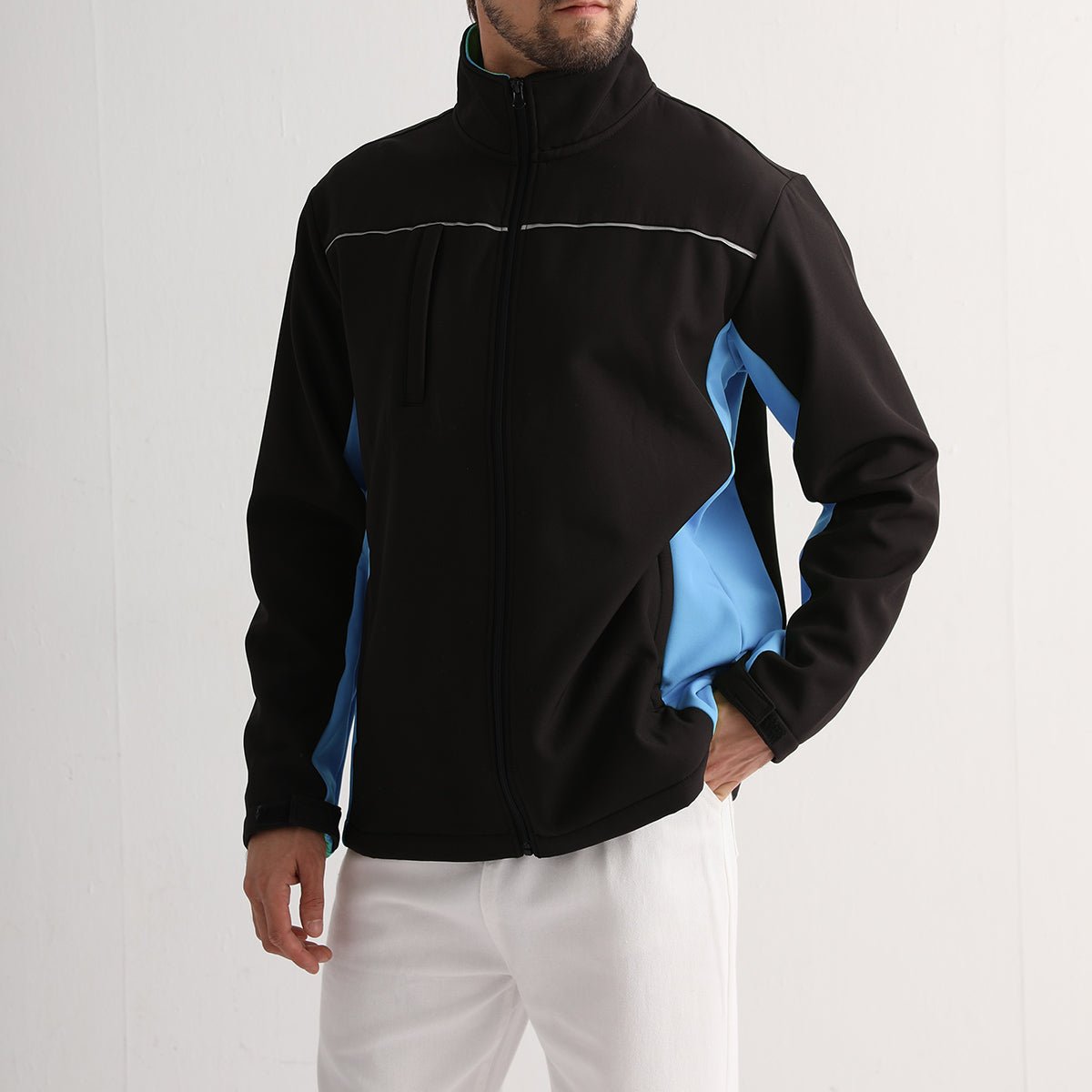 "panel softshell jacket in Black with Aqua Blue, model in action – Big Bee Workwear"