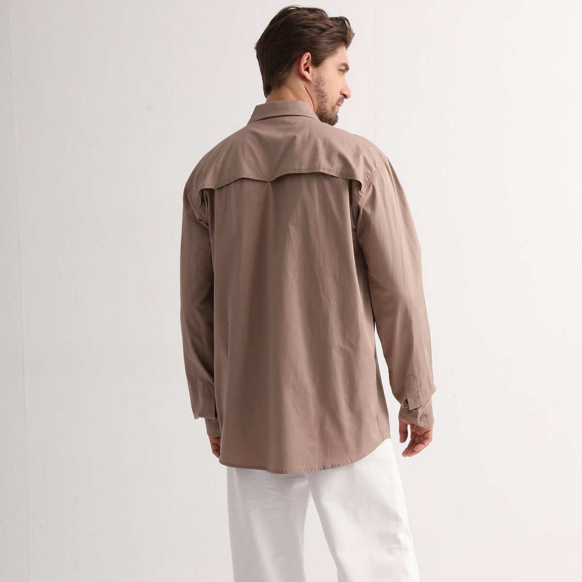 "Men’s Lightweight Cotton Work shirt in khaki, Long Sleeve, model back – Big Bee Workwear"