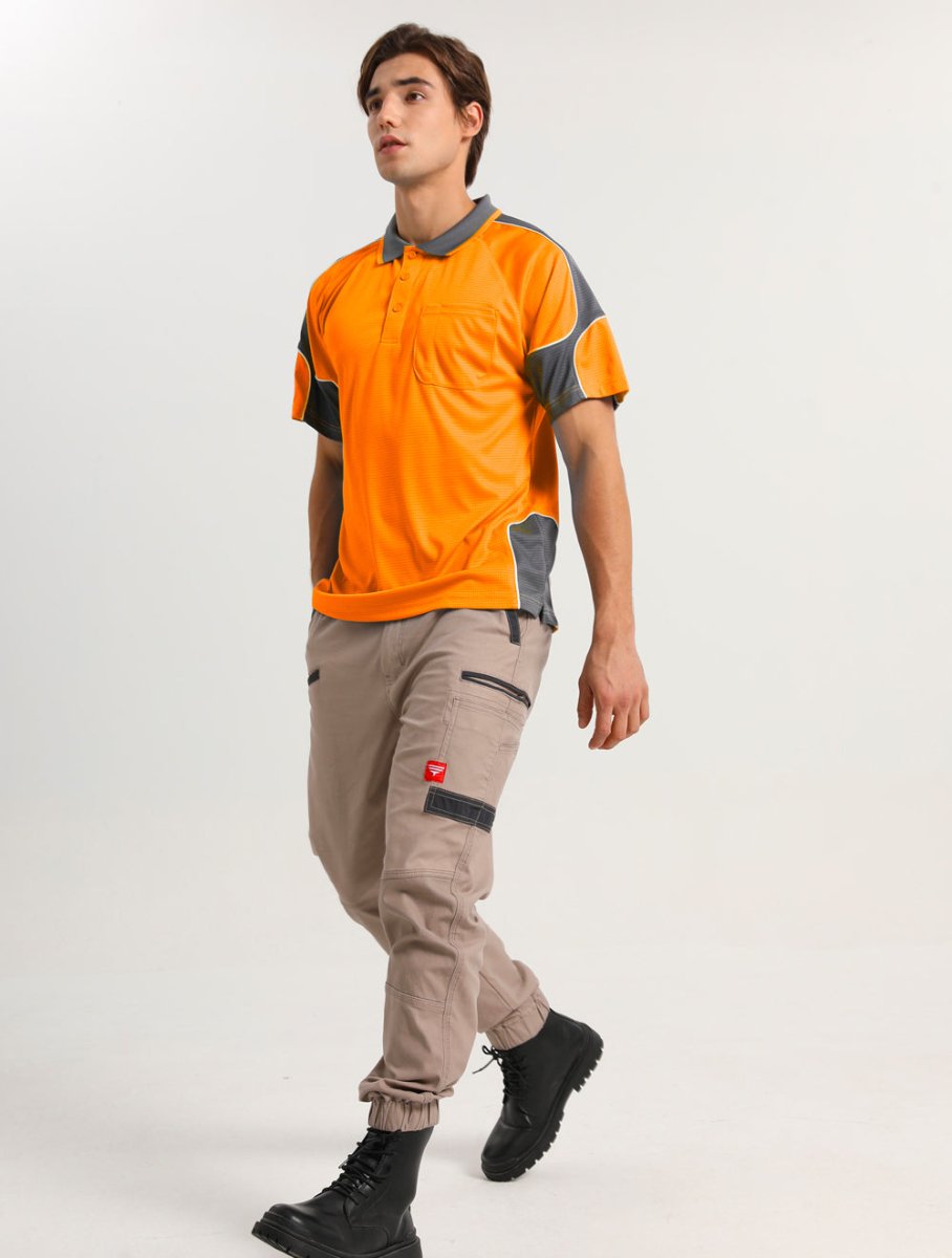 "Hi-Vis Short Sleeve Panel polo shirt in orange with grey charcoal, model posed – Big Bee Workwear"