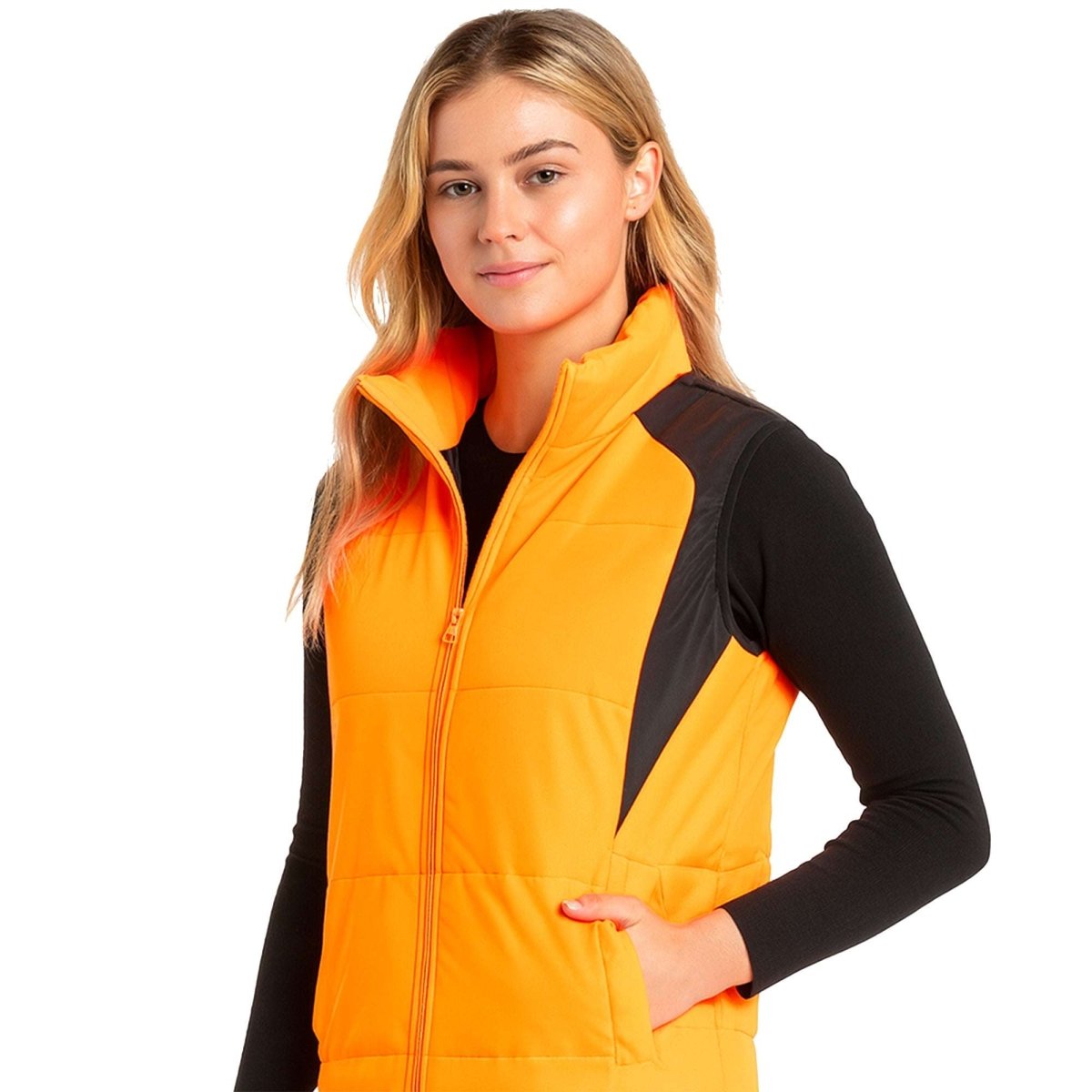 "ladies strike puffer vest in orange, model side – ISUSI"