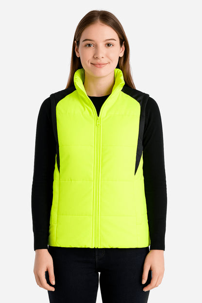 "ladies strike puffer vest in yellow, model posed – ISUSI"