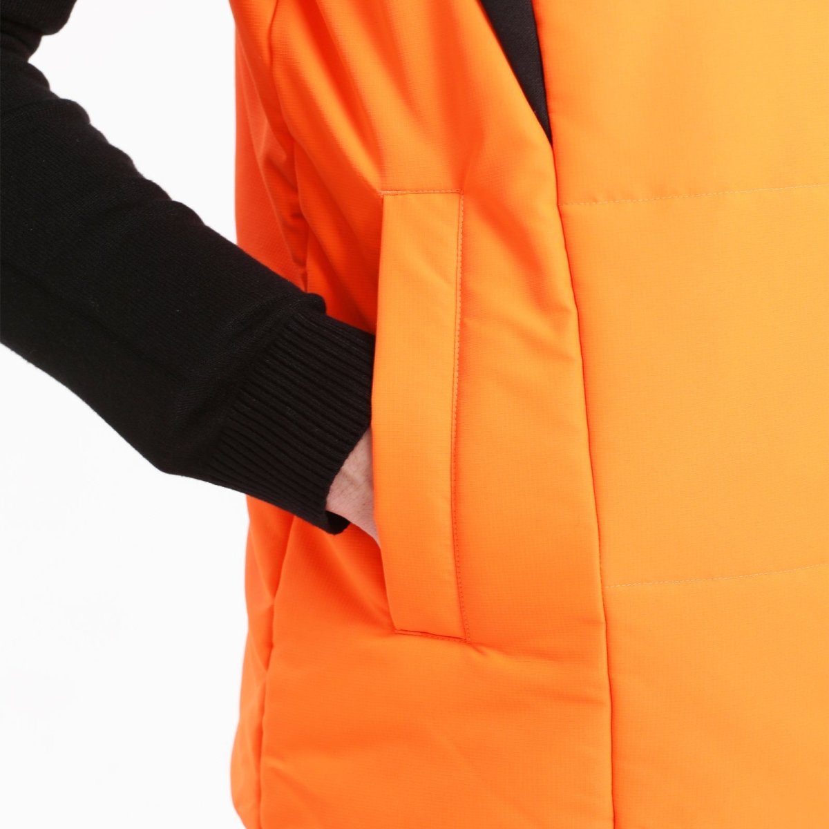 "ladies strike puffer vest pocket detail close-up – ISUSI"